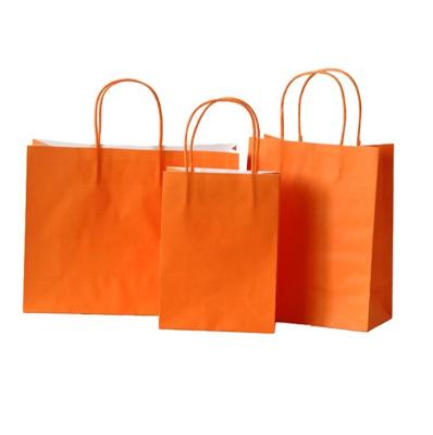 China Recyclable Custom Logo Printing Acceptable Cheap Orange Color Kraft Paper Shopping Bag for sale