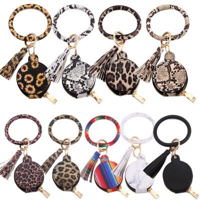 China Bag Charms Ring Bangle Tassel Keychain With Key Ring Earbuds Key Chain Bangle Leather Bangle Portable Makeup Mirror for sale