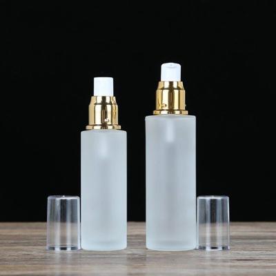 China Spray Bottle Gold Lid Cosmetic Glass Lotion Pump Bottle Empty Cosmetic Packaging Containers Frost Glass for sale