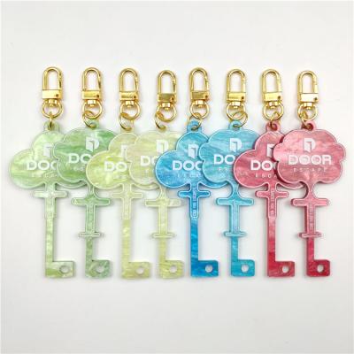 China Promotion Gift Custom Magic Plastic Acrylic Key Shape Key Indicator Design Twinkle Star Key Chain Unique Key Indicator for sale