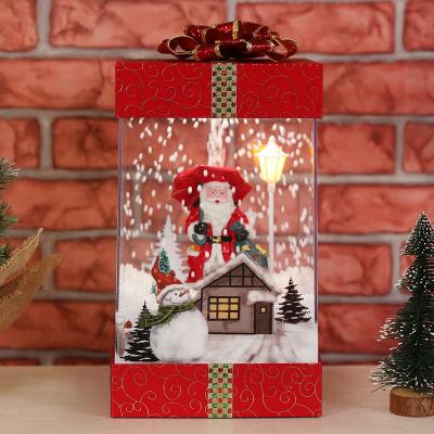 China Holiday Home Decoration LED Lighted Square Gift Box With Santa Figure$ Snowfall Scene For Christmas Decor for sale