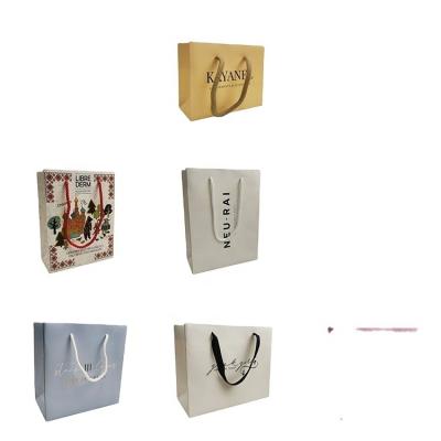 China Recyclable Wholesale Custom Logo Paper Gift Bags Costume Art Paper Shopping Bag for sale