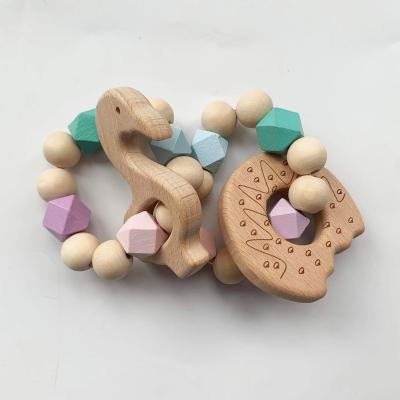 China Soft Toy New Design Sensory Baby Teething Toys Ratchet Soft Wooden Baby Teether Bpa Free for sale