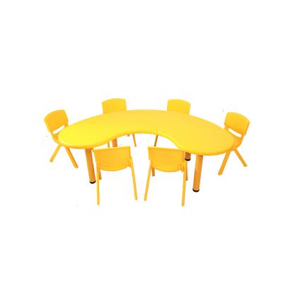 China Indoor yellow color half moon shape plastic children plastic study table for sale for sale