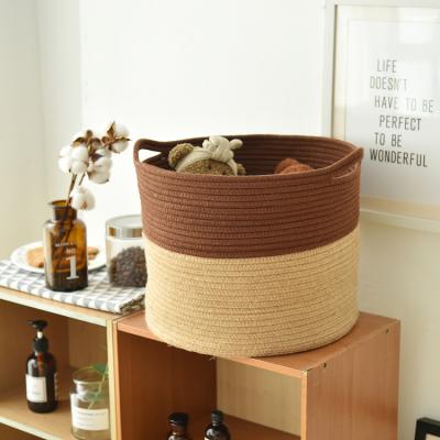 China Sustainable Round Woven Cotton Rope Laundry Storage Basket With Handles Organizer Bin Multi Function Storage Basket for sale