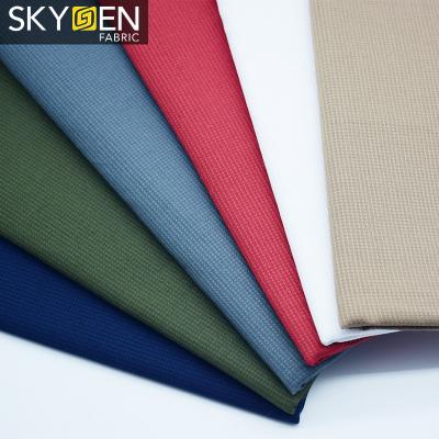 China New Fashion Dobby Solid Color Anti-static 100% Cotton Woven Shirting Fabric for sale