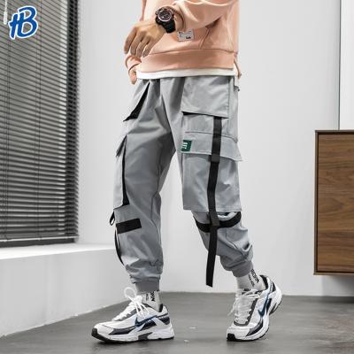 China Anti-wrinkle 2019 autumn new fashion design loose fitted 6 pocket men's cargo pants with custom fabric stripes printing logo for sale