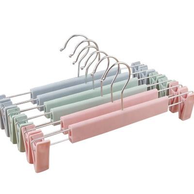 China Multi-functional plastic hanger eco-friendly durable color space saving clips custom logo warm anti-slip trouser hanger for sale