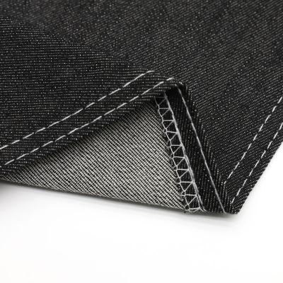 China Shrink-Resistant Made-to-Order 11.1oz Super Mercerized Black Rolls Of Stretch Denim Fabric for sale