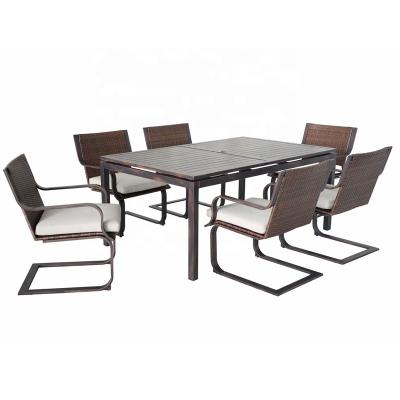 China Traditional Outdoor Rattan Patio Dining Table And Spring Motion Wicker Chairs Set All Weather Aluminum Furniture for sale