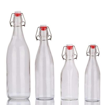 China Fashion Cheap Stored Flip Top Cooking Oil Round Glass Bottle Swing Top 60ml 100ml 250ml 500ml 750ml 1000ml for sale