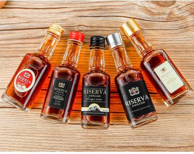 China Small beverage 50ml 100ml 150ml liquor bottle with custom logo mini tequila. glass bottles with cork lid for sale