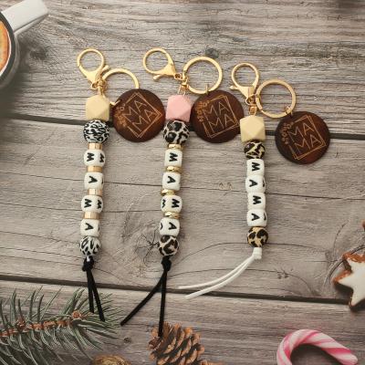 China Custom Mom Key Chain Wood Bead Silicone Bead Metal Mother's Day Gifts For Bag Accessories Letter Key Chain for sale