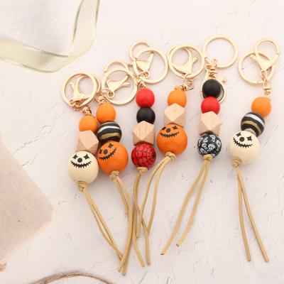 China Wooden Bohemian Rainbow Beaded Key Chain Wooden Silicone Beads Key Chain Tassel Mother's Day Gift Wooden Bead Pendant Key Chain for sale