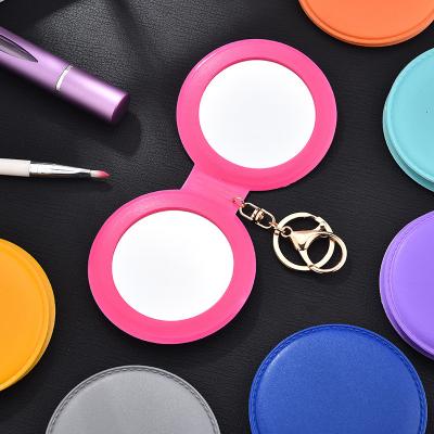 China Candy Color Glass Makeup Mirror, Small Round PU Mirror Portable Folding Makeup Mirror Head Chain for sale