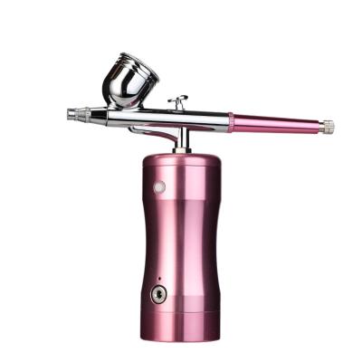 China Portable Makeup Airbrush 2021 0.3mm Hat 7cc Base Spray Airbrush Kit with Air Compressor for sale