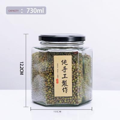 China New Design 730ml Hexagon Food Glass Honey Bottle Storage Glass Honey Tank With Matal Lid for sale