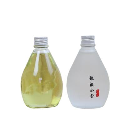 China 150ml 270ml 350ml 500ml Beverage Round Beverage Glass Bottle Water Juice Milk Wine Bottle With Metal Screw Top for sale