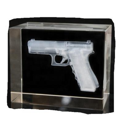 China China high quality k9 crystal glass cut gun crystal model inside for sale