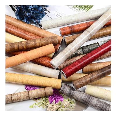 China Post-modern wood texture PVC self-adhesive wall sticker waterproof and antifouling furniture ren 3D home decoration par and stick wallpaper for sale