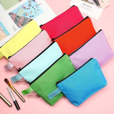 China Fashion Hot Selling White Logo Bulk Travel Plain Pouch DIY Custom Universal Toiletry Bag Canvas Makeup Bags for sale