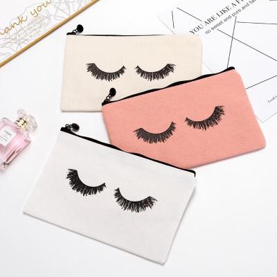 China Hot Selling Amazon Waterproof Canvas Toiletry Cosmetic Pouch Letter Cosmetic Bag With Zipper for sale