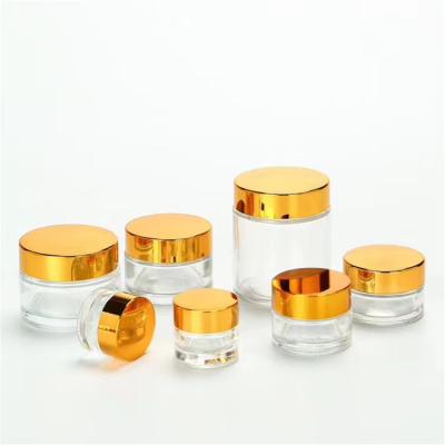 China 10ml 15ml 20ml 30ml 50ml 100ml recycled clear amber glass cosmetic jar 5ml glass jar with black plastic cap for face body cream for sale