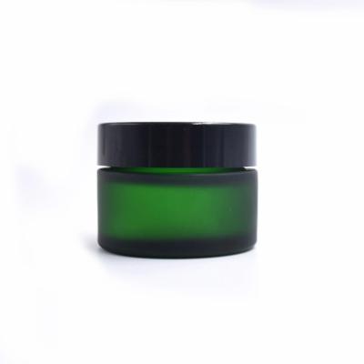 China 30g Dark Green Glass Cosmetic Jar Skin Care Cream Green Cosmetic Glass Jar With Black Aluminum Cap for sale