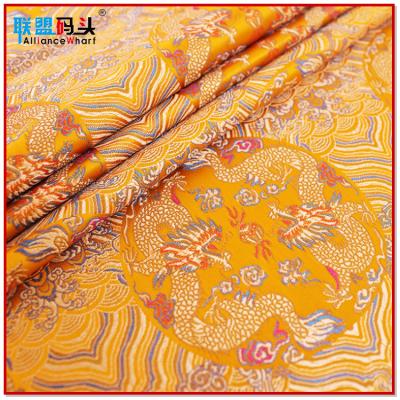 China 50% Polyester Fabric Cheap Price Satin Jacquard Satin Gold Dragon Tibetan Brocade Fabric For Viable Printed Chinese Clothing for sale