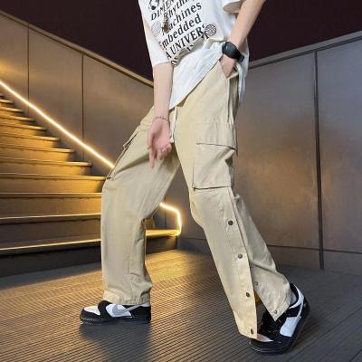 China QUICK DRY High Street Pants Mens Loose Fashion Trend Wide Leg Pants Buttons Pockets Side Cargo Pants for sale