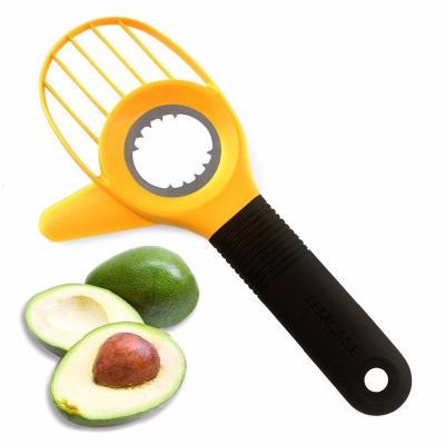 China Kitchen Instrument Tool Viable Plastic Grabs 3-in-1 Multifunctional Fruit Knife Hollow Puncher Cutter Avocado Slicer for sale