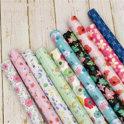 China Recyclable Patterns Christmas Wrapping Paper Roll Coated Pulpwood Wrap Gift Paper Gift Wrapping Paper Roll for sale