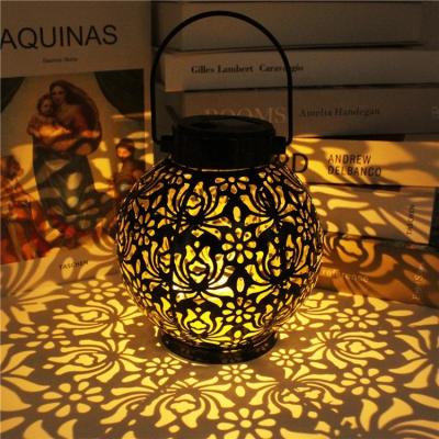 China Garden Lantern Waterproof Solar Light LED Lantern Projection Light Hollow Wrought Iron Hanging Lamps for Garden Yard Outdoor Art for sale