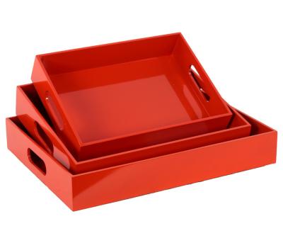 China Handmade wooden rectangular serving tray with cutout handles set of finish three red orange coated for sale