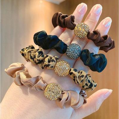 China New Hot Sale Scrunchie Silk Elastic Hair Scrunchies Fashion Women Shiny Ball Satin Fashionable Long Hair Ties for sale