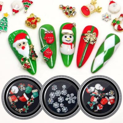 China Hot Selling Decoretions 2022 Alloy Christmas Nail Rhinestone Charm Nail Ornaments Bell Hat Sock Gift Gold Silver Snowflakes With Rhinestone Nail Art Decorations for sale