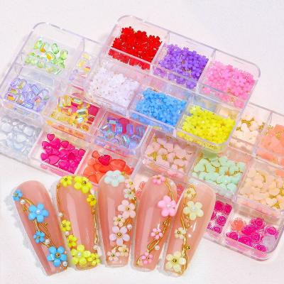 China Hot Selling DIY Nail Art Magic Light Changing Small Jewelry Art Decoration Box Mixed 3D Camellia Flower Bow Heart Nail Flower Resin Nail for sale