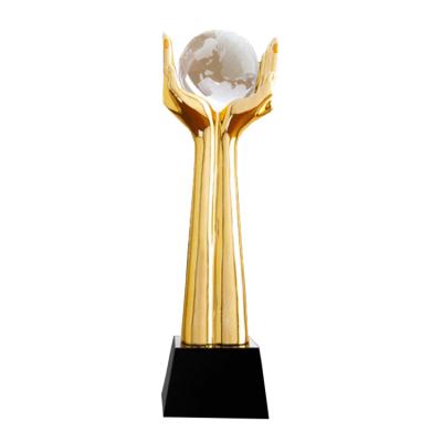 China Cheap World Sports Resin Trophy With Crystal Ball for sale