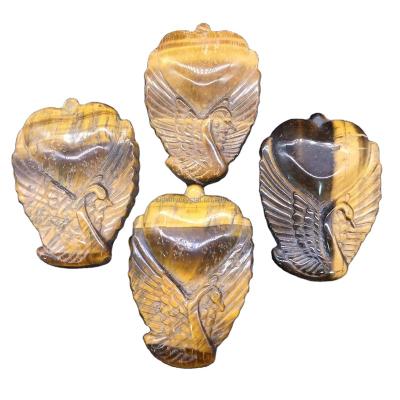 China Hot Selling Europe Natural Tiger Eye Stone Quartz Crystal Carved Swan Heart Healing Decoration for sale