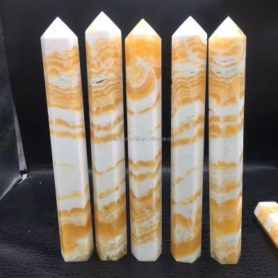 China Wholesale Natural Big Size Orange Calcite Healing Crystal Point Magic Wand From Europe For Decoration for sale