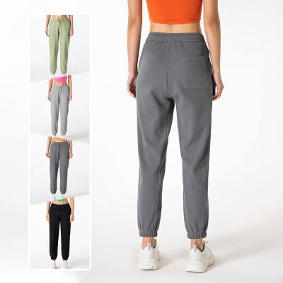 China Wholesale 2022 New Anti-wrinkle waffle fabric high elastic yoga pants casual training loose track pants jogger for women for sale