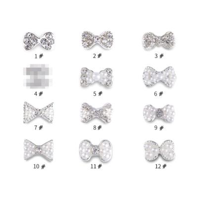 China Environmental Protection Nail Art Supplies Alloy Jewelry Rhinestone Pearl Bow 3D Nail Stickers Nail Rhinestones for sale