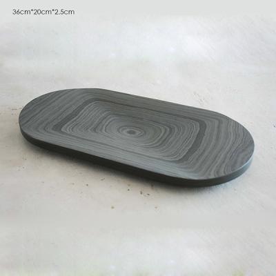 China Black Oval Food Concrete Tray Handmake With Rough Pattern 36cm × 20 cm × 2.5cm for sale