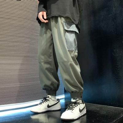 China Anti-Wrinkle OEM Fashion Patchwork Pants Wholesale Hip Hop Cargo Pants For Men for sale