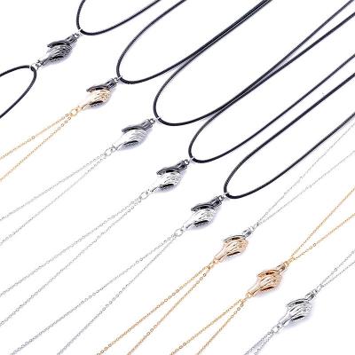 China Hot Selling Valentine's Day Fashion Palm Clavicle Chain Men And Women Couples Magnet Suction Handshake Stainless Steel Necklace for sale