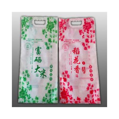 China 1.5Kg Rice Gusset Packing Bag Seal Moisture Proof High Quality Hot Selling Plastic Bags With Handle for sale