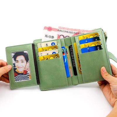 China Small Wind Fashion Waterproof Scented Ladies Short Grab Coin Purses Fold PU Leather Wallets for sale