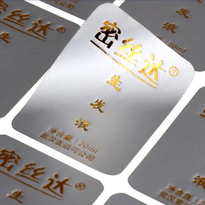 China Waterproof Custom Printing Gold Foil PVC Silver Self Adhesive Labels for sale