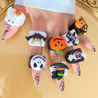 China KISSWIFE Fashionable Plastic Acrylic Pumpkin Skull Finger Rings Black and White Halloween Toy Belly Charms Jewelry For Women for sale