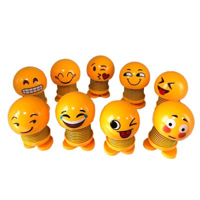 China Cartoon Toy Cute Gift Wholesale New Arrival Hot Selling Face Spring Smile Doll For Car for sale